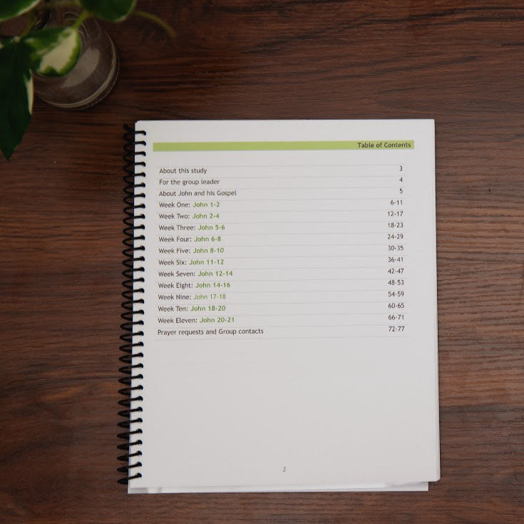 Table of contents: Follow After Him, study of Gospel of John workbook; on wood table